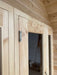 A close-up of the sturdy door hinge and smooth wood grain on Sawmill Structures CabinSauna
