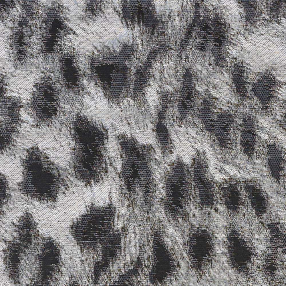 A close-up of the surface design of Couristan Dolce Indoor/Outdoor Rug - Lynx/Ivory-Charcoal reveals its abstract leopard-like pattern