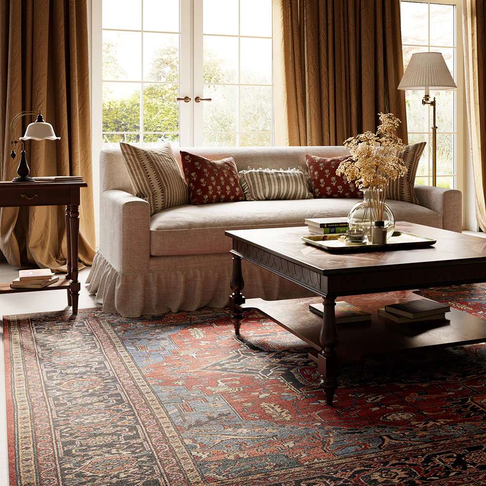 A close-up shows Momeni Afshar Indoor Rug - AFS37 Red beneath a sofa and coffee table