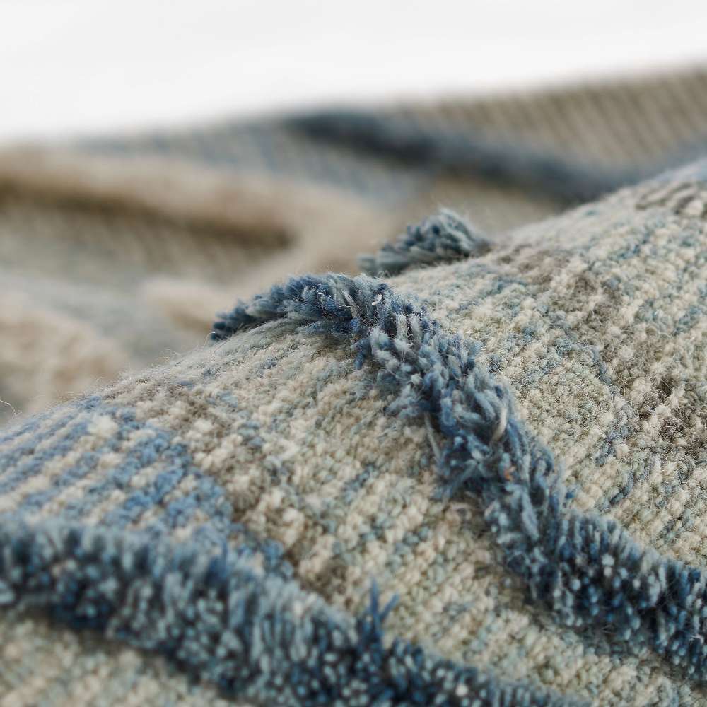 A close detail of Momeni Allegro Indoor Rug - ALL-1 Blue shows its thick, durable yarns and multi-dimensional weave