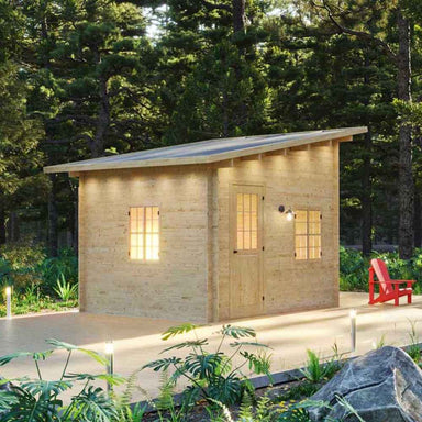 A compact wooden cabin with soft glowing lights and a red chair outside is the Sawmill Structures Multi Cube Versa 100 Garden Room set in a forest clearing
