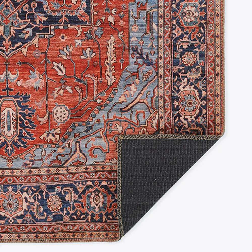 A corner fold of Momeni Afshar Indoor Rug - AFS37 Red highlights its durable backing and intricate antique-inspired patterns