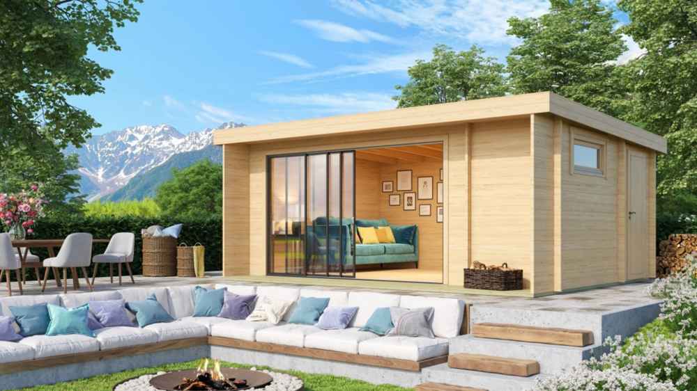 A cozy GardenHouse24 USA ALU Concept 70B Garden Room with large glass doors sits above a built-in firepit lounge and mountain views in the background
