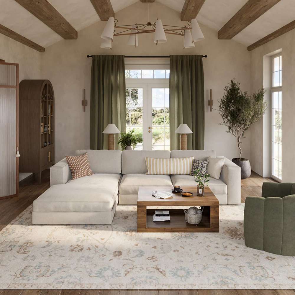 A cozy living room with a sectional sofa and wooden coffee table styled over the Momeni Anatolia Indoor Rug - ANA-5 Beige