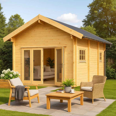 A cozy outdoor seating area sits in front of the GardenHouse24 USA Astrid 70 Garden Room