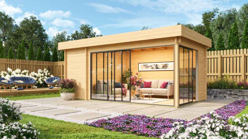 A cozy, sunlit backyard retreat with glass walls and a sofa inside, the GardenHouse24 USA ALU Concept 70C Garden Room blends comfort and nature seamlessly
