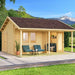 A cozy wooden cabin with a covered front porch and two teal chairs on a patio is the GardenHouse24 USA Lerum 44 Garden Room