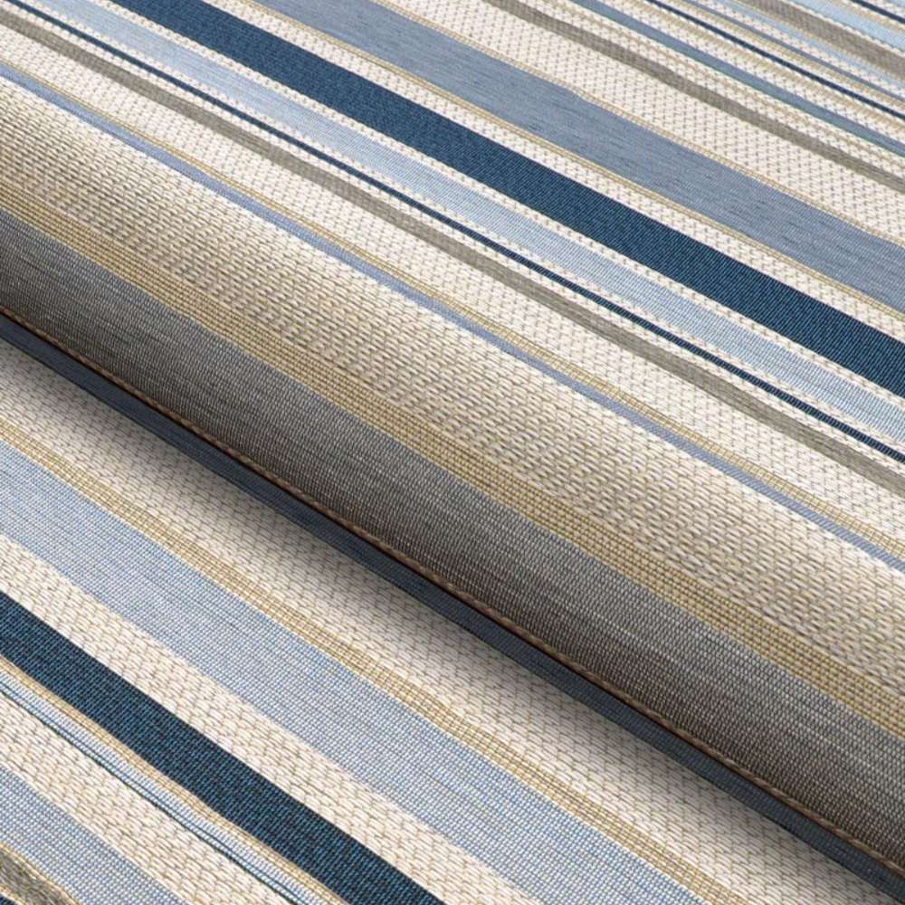 A detailed, angled shot shows the texture and weave of Couristan Dolce Indoor/Outdoor Rug - Striped/Nautical in soft blue and neutral tones
