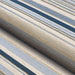 A detailed, angled shot shows the texture and weave of Couristan Dolce Indoor/Outdoor Rug - Striped/Nautical in soft blue and neutral tones
