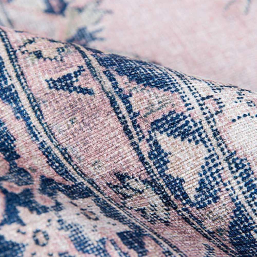 A folded edge reveals the fine woven texture of Momeni Afshar Indoor Rug - AFS30 Pink