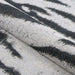 A folded section of Couristan Dolce Indoor/Outdoor Rug - Bengal/Ivory displaying its flexible texture and woven detail