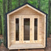 A front-facing shot of Sawmill Structures CabinSauna nestled in the woods