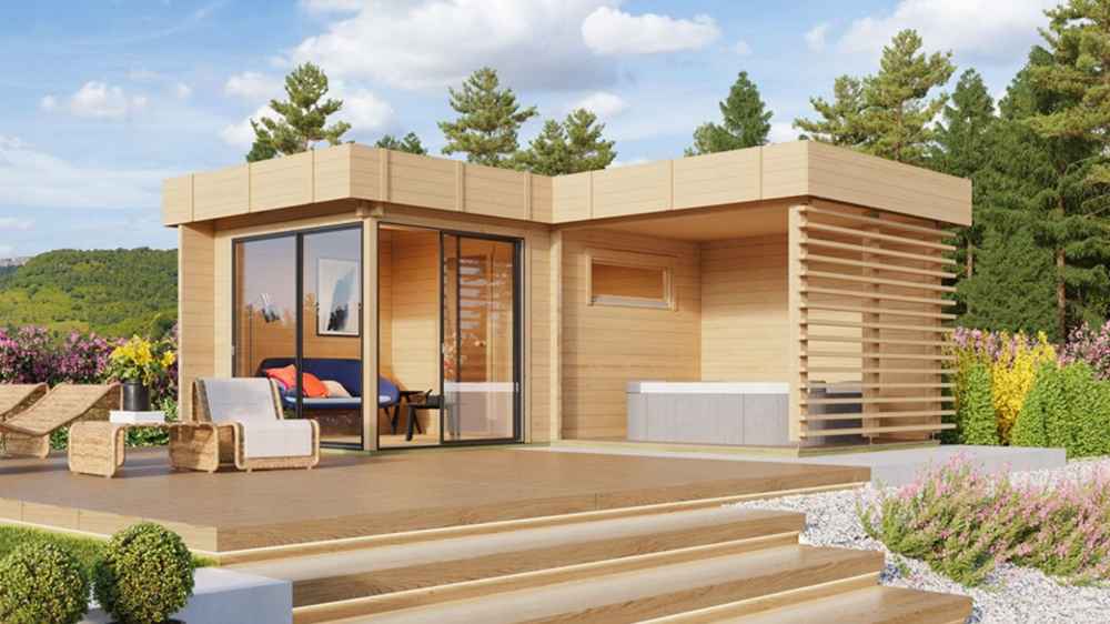 A landscaped deck setup with lounge chairs in front of the GardenHouse24 USA Sauna Forte 70 Garden Room