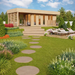 A landscaped version of the GardenHouse24 USA Sauna Largo 90 Garden Room surrounded by bright flowers and lounge chairs in a vibrant backyard setting