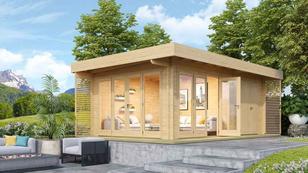 A lifestyle photo of the GardenHouse24 USA Konrad 44 Garden Room shows it placed on a raised patio with lush trees and mountains in the background