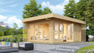 A lifestyle photo of the GardenHouse24 USA Konrad 44 Garden Room shows it placed on a raised patio with lush trees and mountains in the background