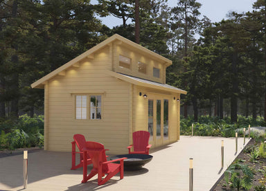 A light wood cabin with a sloped roof, glass double doors, and red chairs on a deck is the Sawmill Structures The Versa 160 Atrium 70MM Garden Room nestled in a forest