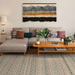 A living room setup features Couristan Fez Indoor/Outdoor Rug - Medina/Earthen under a modern sofa and wooden coffee table