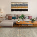 A living room setup featuring Couristan Fez Indoor/Outdoor Rug - Palais/Storm Grey, styled under a sofa, coffee table, and wall art