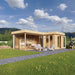 A modern GardenHouse24 USA ALU Concept Quinta 70 Garden Room with glass walls and a cozy outdoor seating area