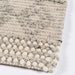 A neat edge close-up shows the fine craftsmanship of Momeni Andes Indoor Rug - AND-10 Ivory