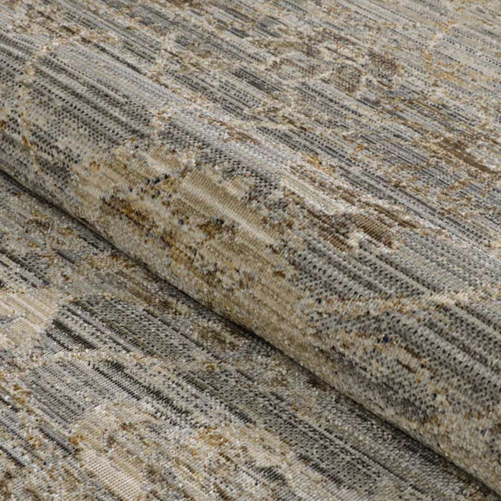 A rolled section of Couristan Fez Indoor/Outdoor Rug - Palais/Storm Grey