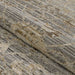 A rolled section of Couristan Fez Indoor/Outdoor Rug - Palais/Storm Grey