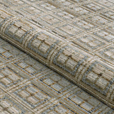 A rolled section of Couristan Fez Indoor/Outdoor Rug - Sidi/Sunlight displays its durable weave and raised pattern texture