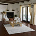 A rustic living space with the Momeni Andes Indoor Rug - AND-8 Ivory