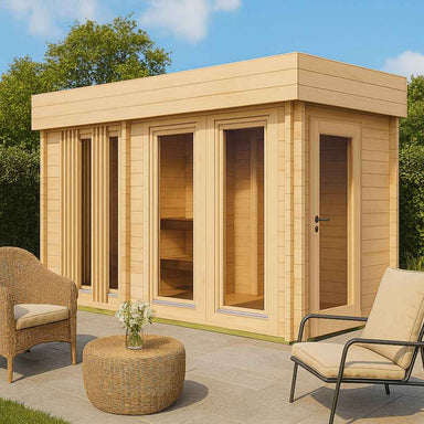 A sunny garden scene with wicker furniture beside the GardenHouse24 USA Sauna Giusto 70 Garden Room