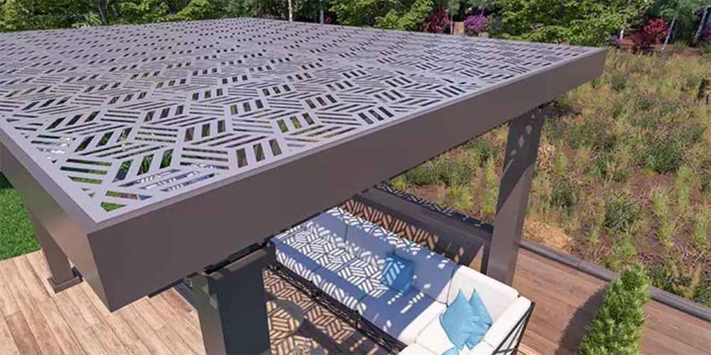 A top-down view shows the intricate geometric cutouts of the Structureworks Solare Fiberglass Pergola casting patterned shadows on a sofa below