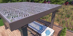 A top-down view shows the intricate geometric cutouts of the Structureworks Solare Fiberglass Pergola casting patterned shadows on a sofa below