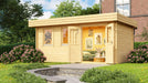 A vibrant garden scene showcases the GardenHouse24 USA Miriam 44B Classic Garden Room with open double doors revealing a cozy interior filled with framed artwork, greenery, and a soft sofa