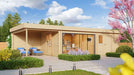 A vibrant spring setting frames the GardenHouse24 USA Sauna St.Moritz 70 Garden Room, with blooming trees, outdoor seating, and a glass-fronted lounge interior