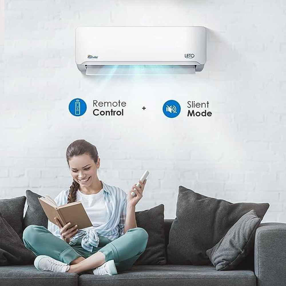 A woman relaxing with remote control access and silent mode from the Senville 30000 BTU Mini Split Air Conditioner - Heat Pump - SENL30CD