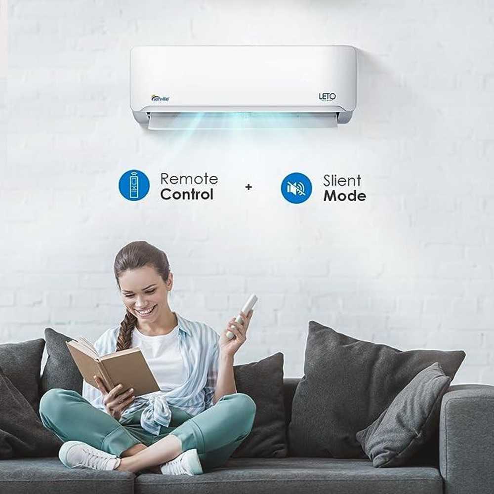 A woman sits comfortably on a sofa using the Senville 9000 BTU Mini Split Air Conditioner - Heat Pump - SENL09CD110V in silent mode with the remote control in hand