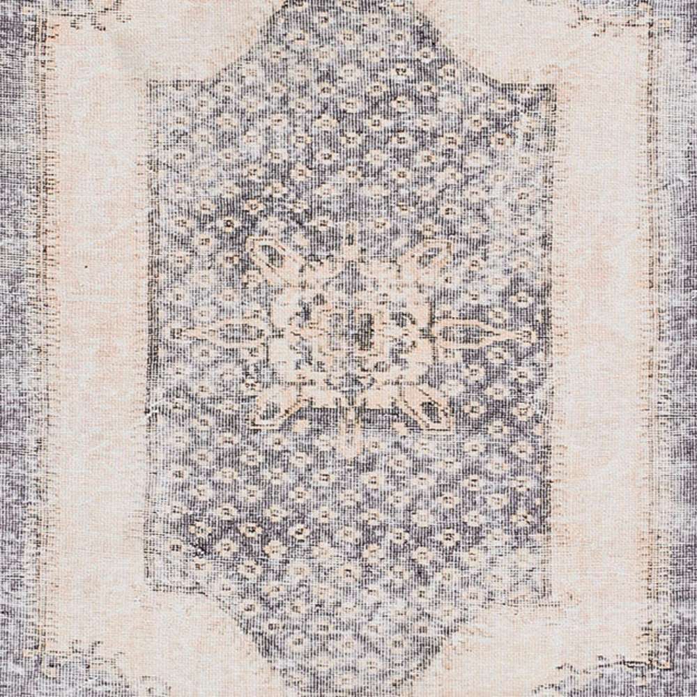 A zoomed-in center detail of Momeni Afshar Indoor Rug - AFS35 Denim reveals the intricate medallion pattern with a distressed finish