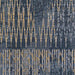 A zoomed-in shot of Couristan Dolce Indoor/Outdoor Rug - Blue Nile/Indigo reveals detailed geometric and stripe patterns in shades of indigo, gold, and dark blue