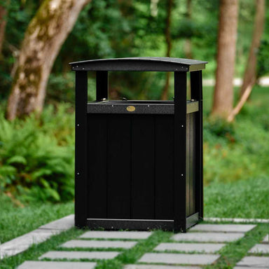 A black poly lumber rectangular outdoor LuxCraft Trash Can with a slightly curved top.