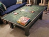 A board game setup on the Game Theory Tables The Origins Coffee Table with game pieces and boxes ready for play