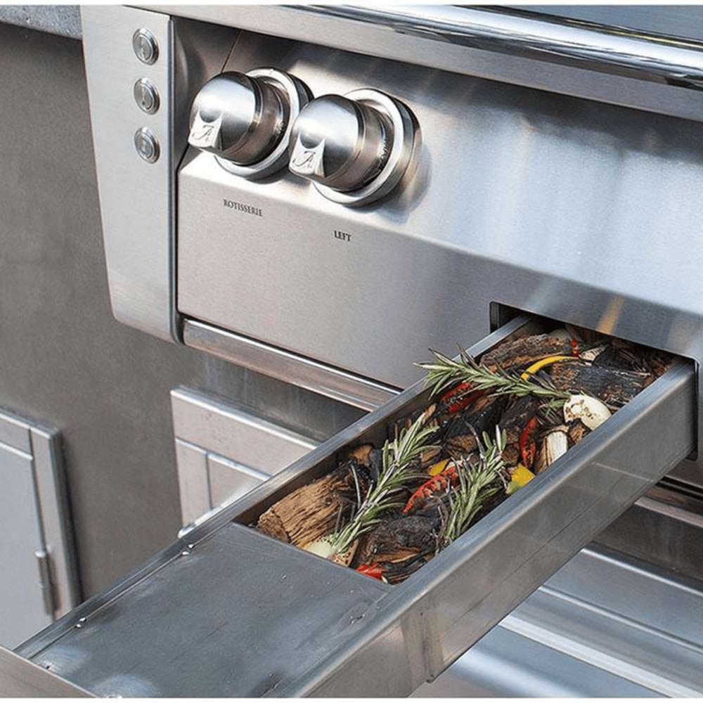 A built-in smoker tray of the Alfresco Grills 56″ Deluxe Grill Built-In filled with aromatic wood chips and fresh herbs