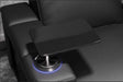 A carbon fiber tabletop attaches securely to the armrest of the Valencia Monza Pillow Top Carbon Fiber Home Theater Seating