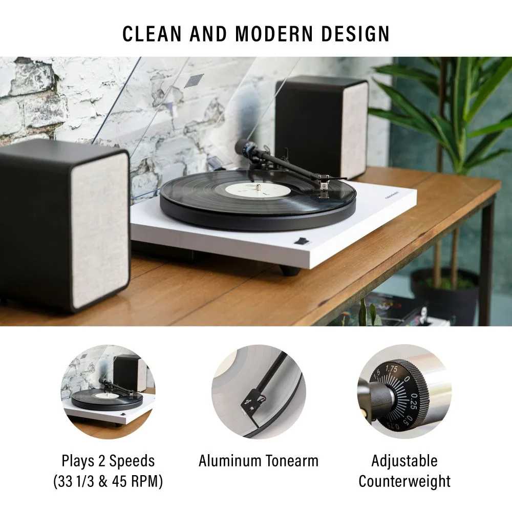 A clean and modern design defines the Crosley KT6101 K-Series Turntable System - White, featuring a sleek turntable setup with matching speakers