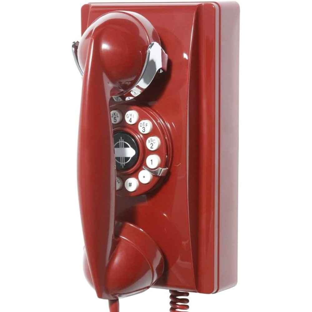 A close-up angle of the Crosley 302 Wall Phone - Red, emphasizing its retro handset and rotary-style dial