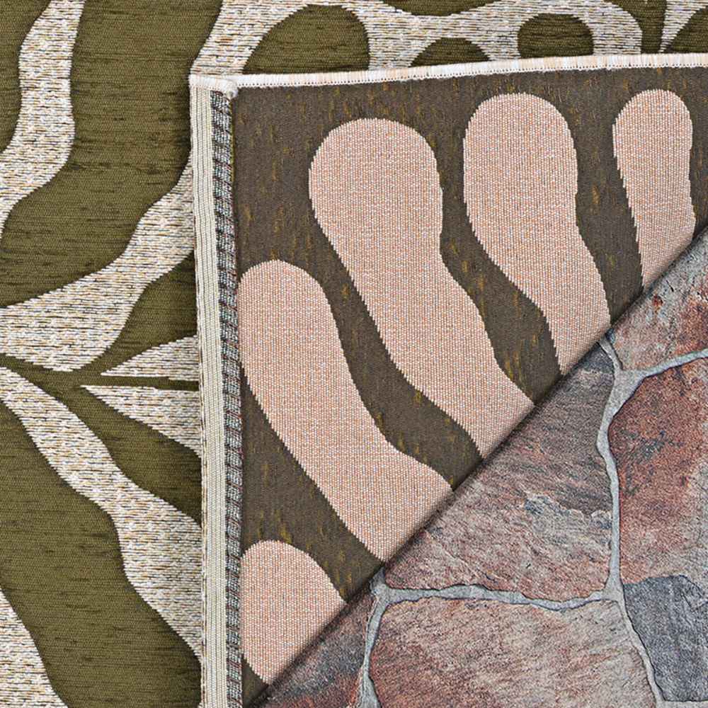 A close-up image shows the detailed weave and dual-sided pattern of the Couristan Castille Indoor/Outdoor Rug - Fiore/Tea Leaf, flipped at the corner to reveal the underside