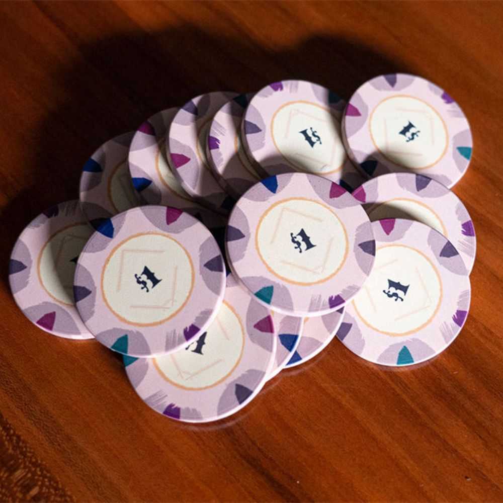 A close-up of several $1 BBO Poker Tables 500-Piece Classic Casino Poker Chips in light purple