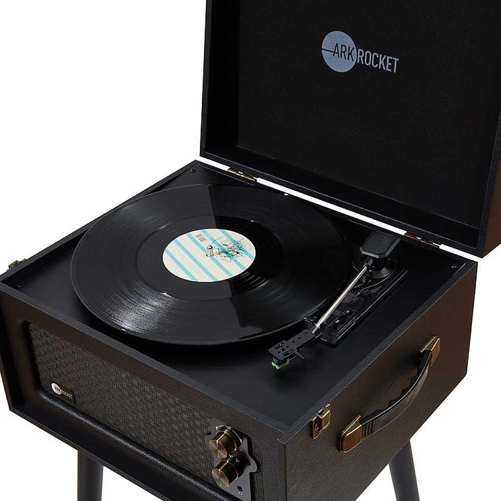 A close-up of the Arkrocket Retro Turntable Wireless Record Player With Legs (Black) shows the turntable playing a record with the lid open