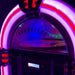 A close-up of the Arkrocket Taurus II Jukebox with Stand - Black 2024 New Upgrade highlighting its bright neon-like red and purple LED lights