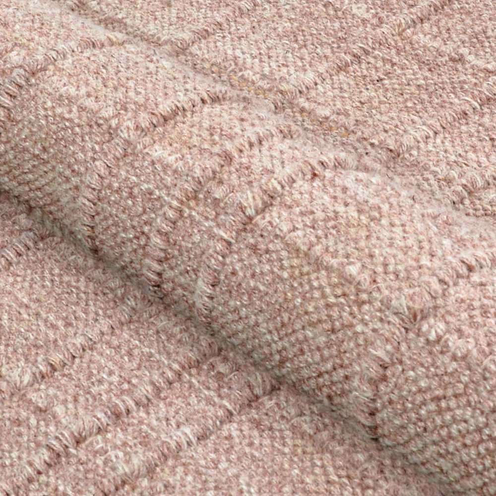 A close-up of the Couristan Ascot Indoor/Outdoor Rug - Windowpane/Rose shows its raised textured pattern with fine, dense yarns