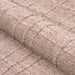 A close-up of the Couristan Ascot Indoor/Outdoor Rug - Windowpane/Rose shows its raised textured pattern with fine, dense yarns
